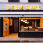 Home 16 한글과 길거리 간판 디자인 - **Cozy Korean Cafe with Minimalist & Neon Aesthetics:**
"A charming and inviting Korean cafe ext...